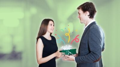 a woman giving her guy friend a birthday gift 1
