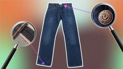 Jeans with magnifying glasses over self edge and custom button