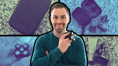 Manscaped Dome Pro Package Review: Smooth Results or Not? 100 The-Adult-Man-Manscaped-model-holding-Dome-Pro-scalp-having-device-with-shaving-head-Dome-Soother-and-carrying-case-in-background