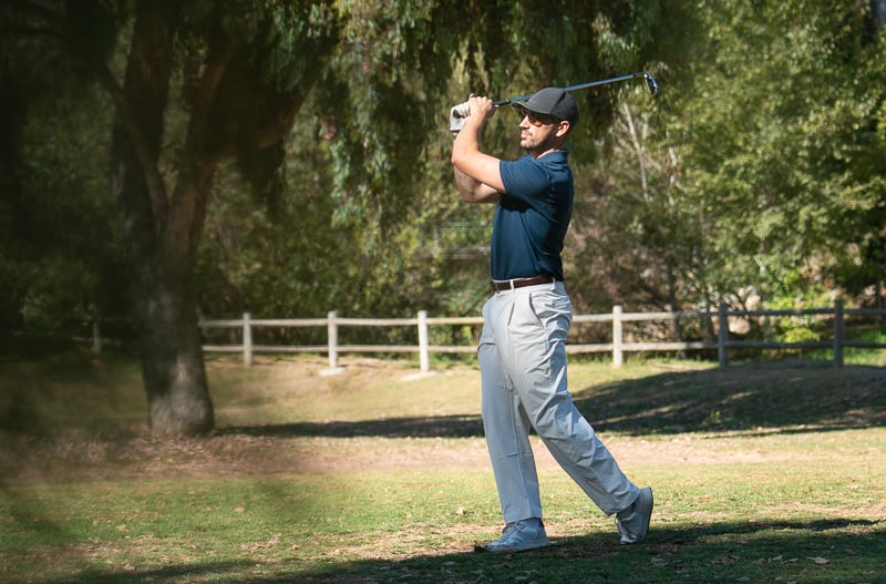 lululemon Fall 2025 Men’s Trousers Haul: My Thoughts 53 Model plays golf in lululemon woven classic fit pleated trouser