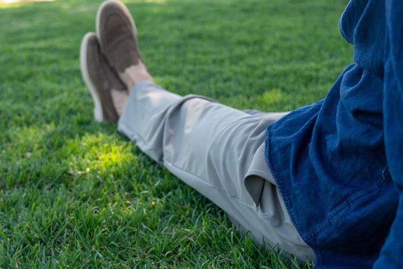 Hands-On: lululemon Daydrift Trousers Review 38 Model sits in grass wearing the Men s Daydrift Classic Fit Trouser