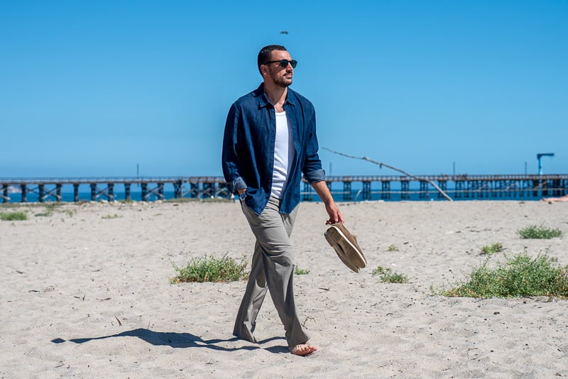 Hands-On: lululemon Daydrift Trousers Review 43 Model walking on beach in the Men s Daydrift Classic Fit Trouser