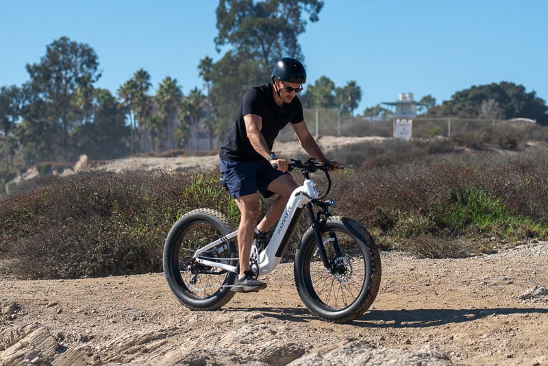 Model riding downhill on Puckipuppy Boxer ST