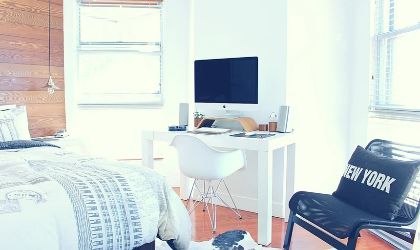 30 Things Every Man Should Do Before Turning Thirty 26 Clean bedroom space with bed, computer and chair