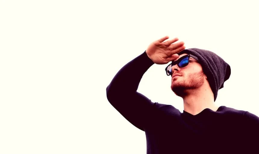 38 Lessons: The Ultimate Guide to Men's Fashion From a Female Perspective 141 Man looking in distance with thermal shirt on and sunglasses