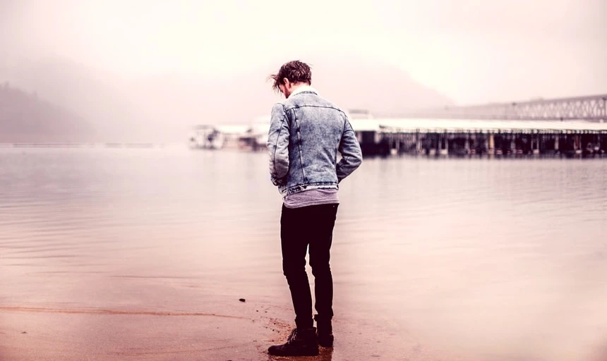 38 Lessons: The Ultimate Guide to Men's Fashion From a Female Perspective 151 Man near water with denim jacket looking away