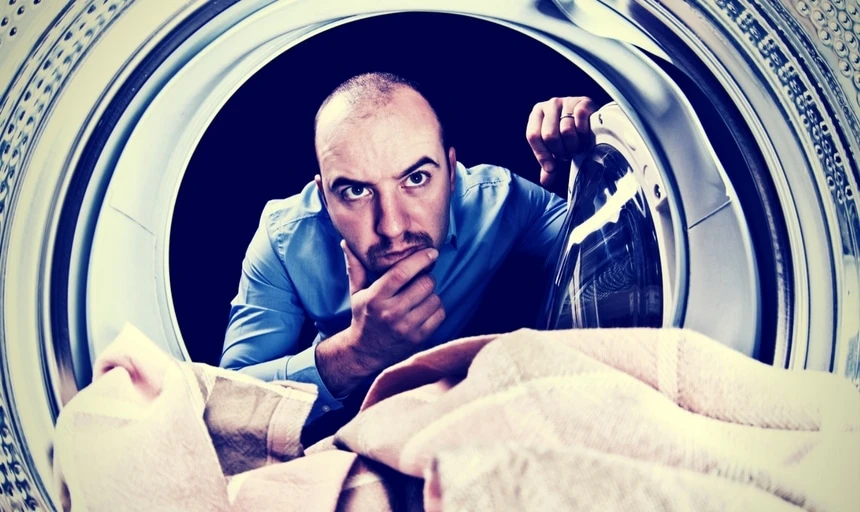 30 Things Every Man Should Do Before Turning Thirty 52 Man with head in dryer trying to figure out how it works