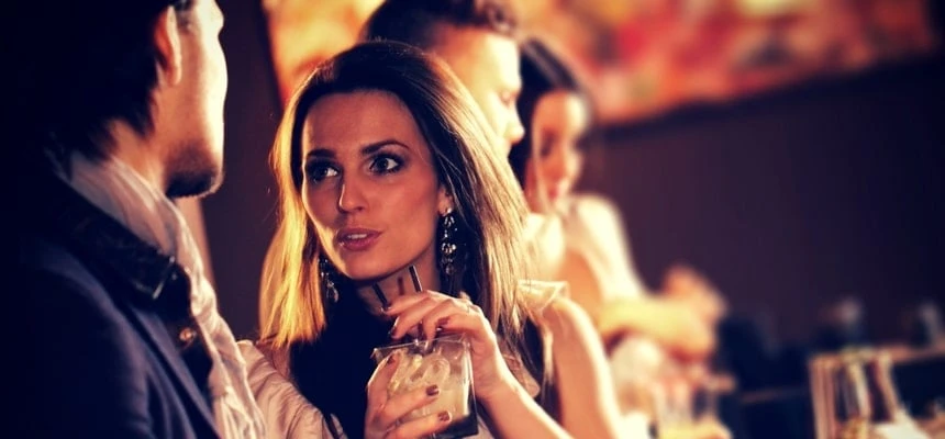 Man talking to attractive woman at a bar Man talking to attractive woman at a bar