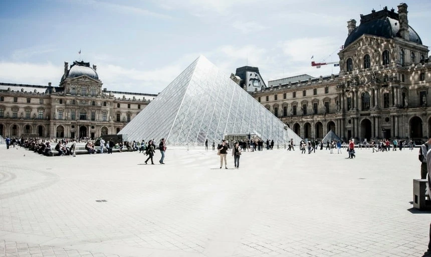 The Louvre, Paris, France. Crowds walking outside