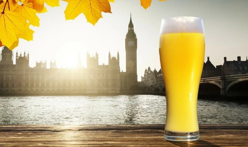 Afternoon view of Big Ben, Westminster, London with a pint of beer