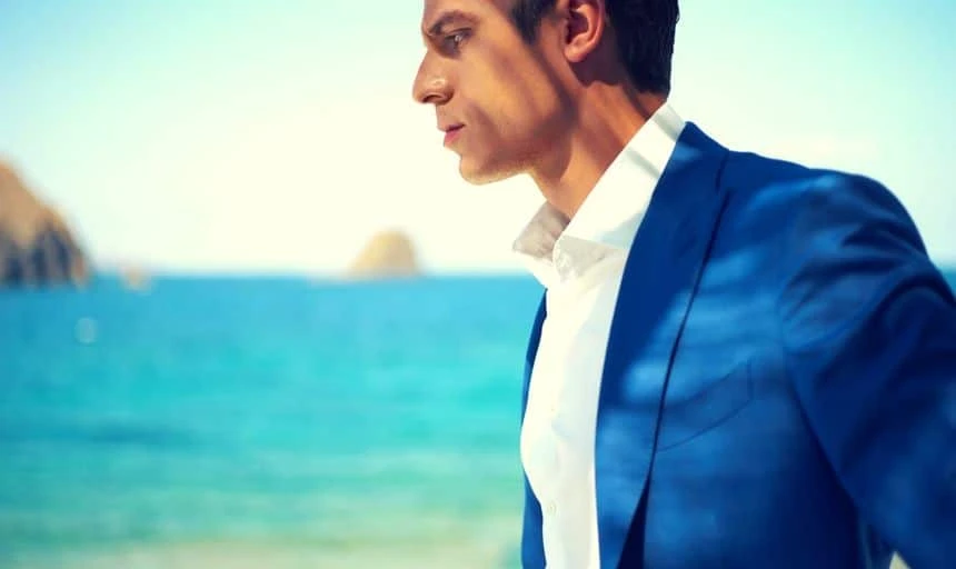 How to Match a Blue Suit with Brown Shoes in Style 56 Attractive man in blue suit and white shirt at the beach