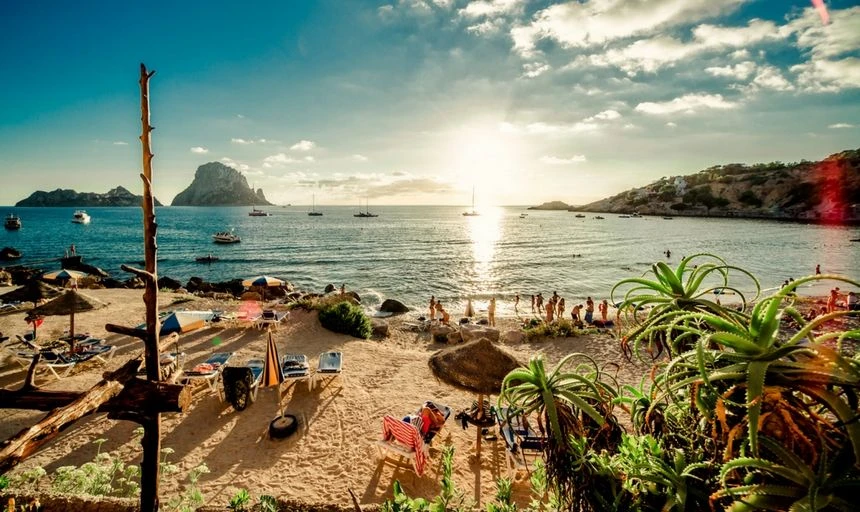 Ibiza at sunset, people on the beach