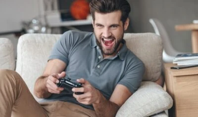 2017/05/Handsome-guy-excited-to-be-playing-video-games-on-the-couch-e1591383002661.jpgw3.webp