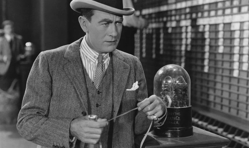 Business man in a suit with a ticket at the old stock market - black and white, vintage