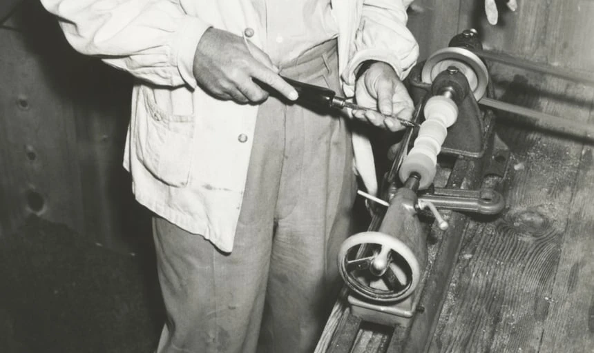Carpenter working on furniture - black and white vintage