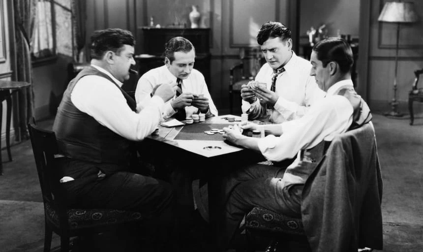 Four business men playing poker - vintage black and white
