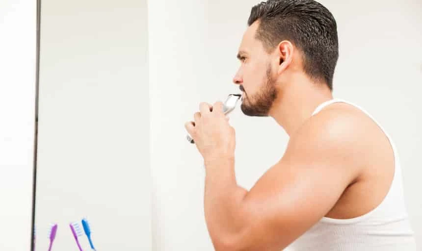 man with trimmer about to clean up around the edges