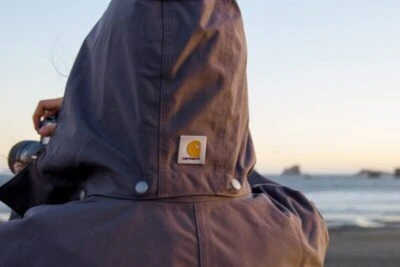 2019/07/Man-holding-camera-and-taking-photos-while-wearing-Carhartt-Shoreline-Jacket-at-the-ocean-e1593906422688.jpgw3.webp
