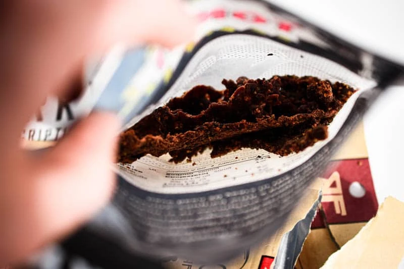 hand reaching into bag hand reaching into bag