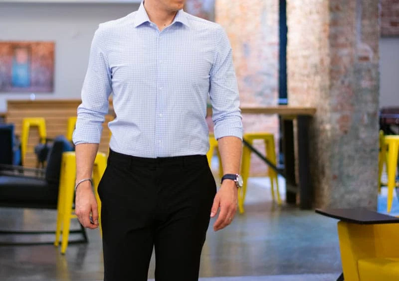 model walking toward camera with slacks and shirt from truwear performance brand model walking toward camera with slacks and shirt from truwear performance brand