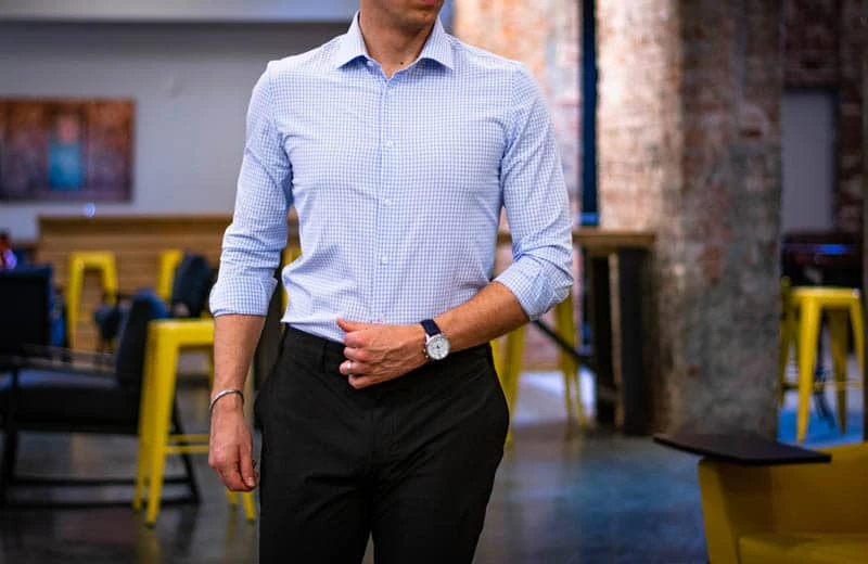 6 Best Dress Shirts for Muscular Guys: Lifters, Rejoice 53 model with watch wearing dress shirt and slacks from truwear