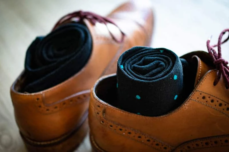 teal and navy polka dot sock rolled into leather oxford shoe teal and navy polka dot sock rolled into leather oxford shoe