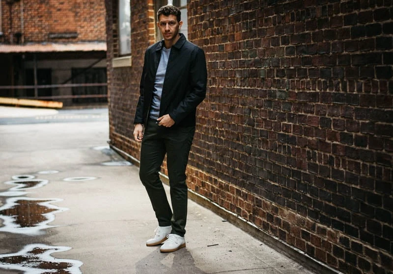model standing in alley with asket minimalist outfit