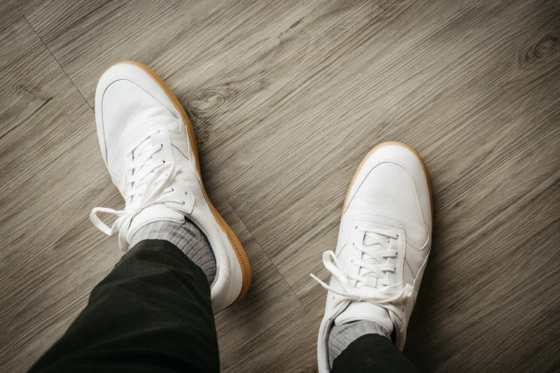 top down view of white minimalist everlane tread sneakers