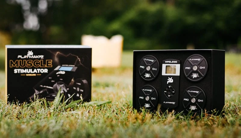 Close up of PlayMakar wireless muscle stimulator in packaging