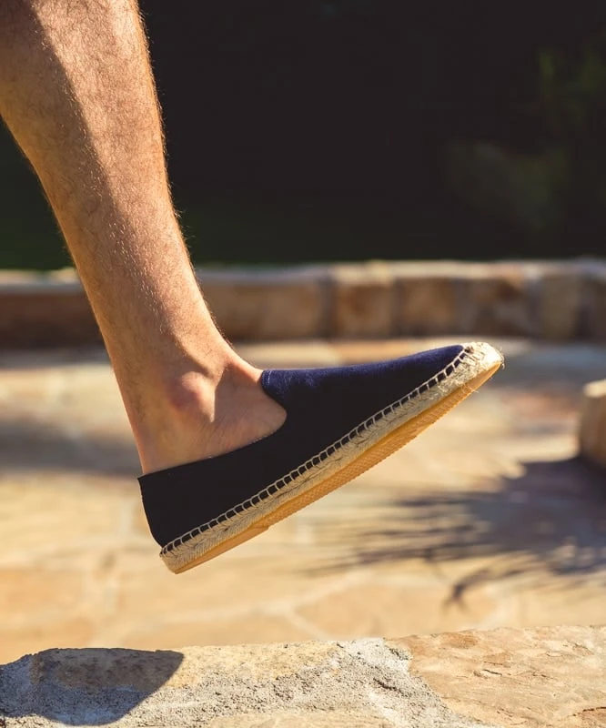Espadrille on stone walkway