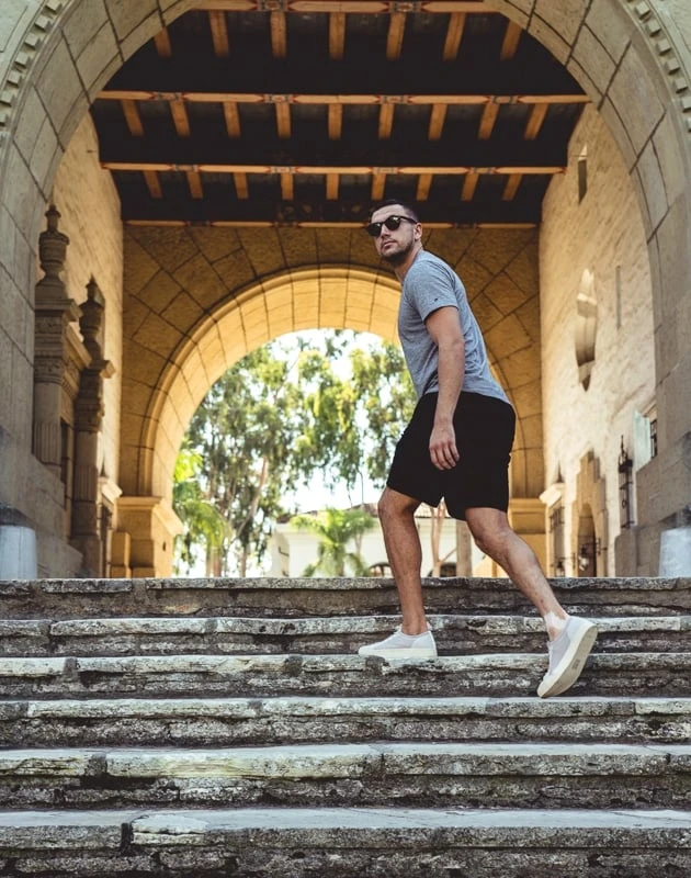 Man in grey Soludos turning around