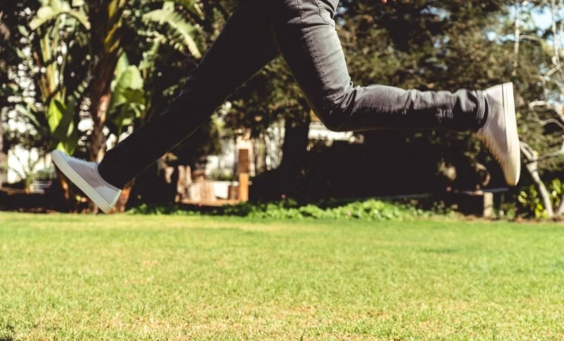 Man jumping mid air in Soludos
