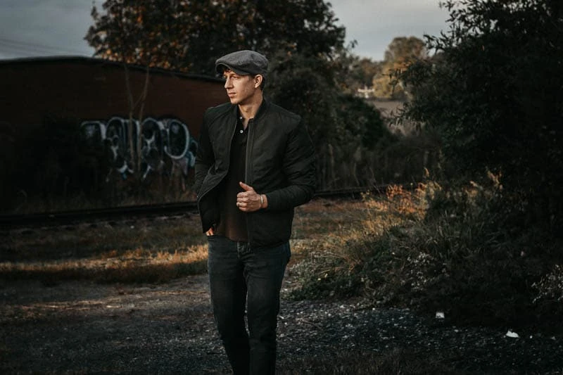 Men's Hat Styles: 13 Types of Hats Every Stylish Man Should Know 42 model wearing bomber jacket from style plan by frank and oak