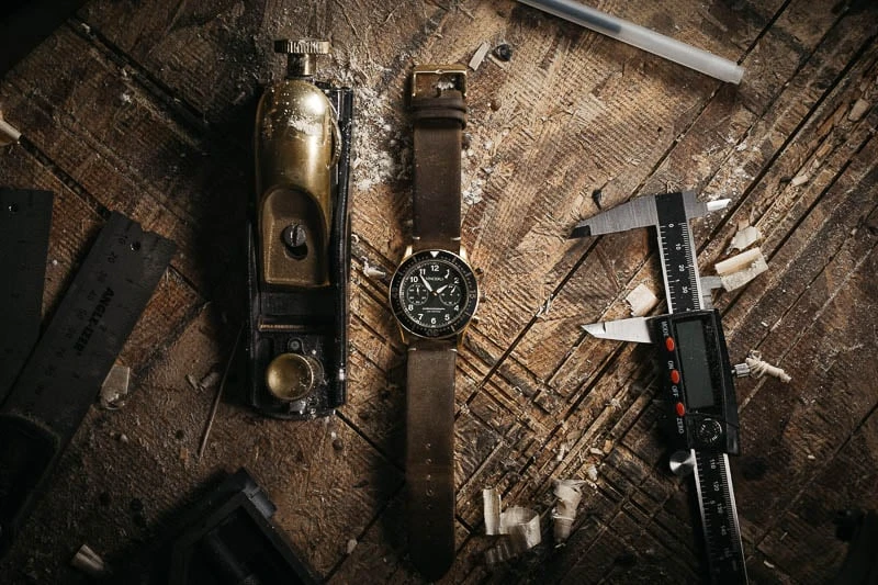 Types of Watch Glass: Sapphire Crystal vs Mineral vs Acrylic 35 Vincero Outrider next to tools