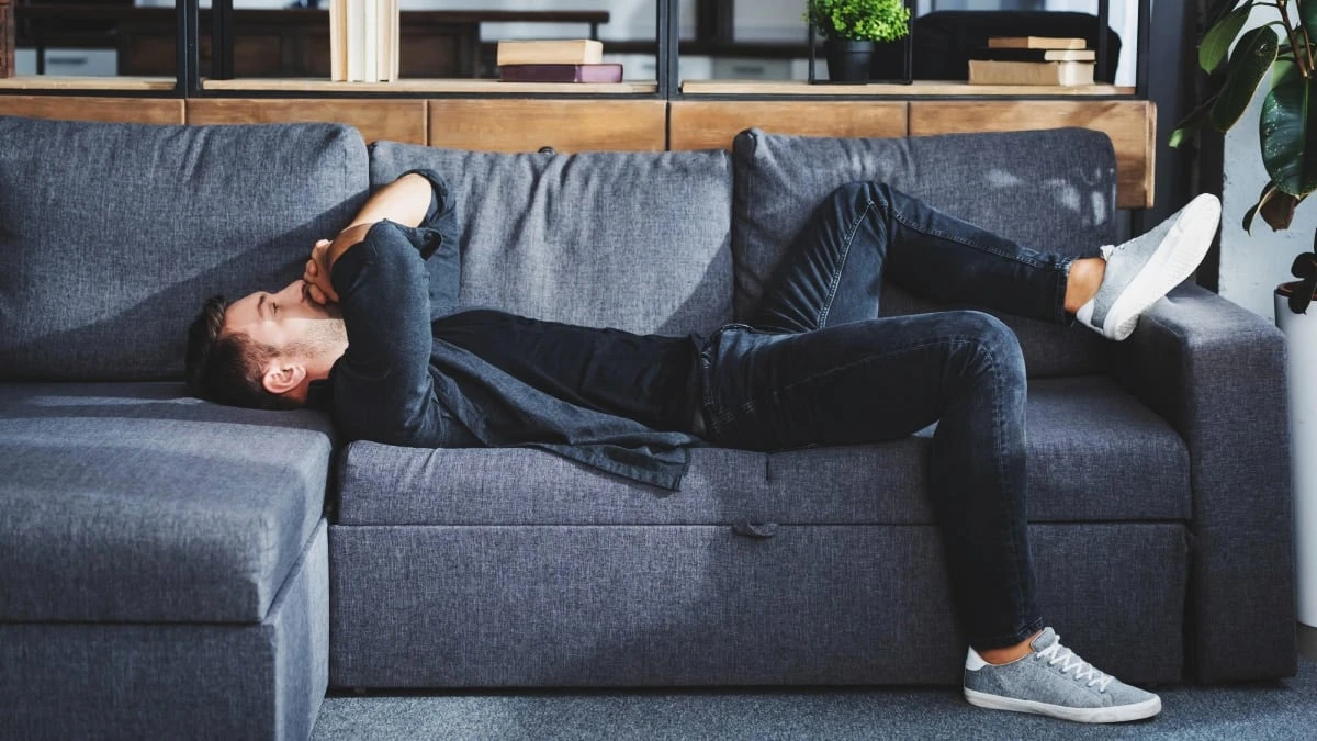 Why Is Life So Hard Stylish Man Having a Bad Day Lying on Sofa