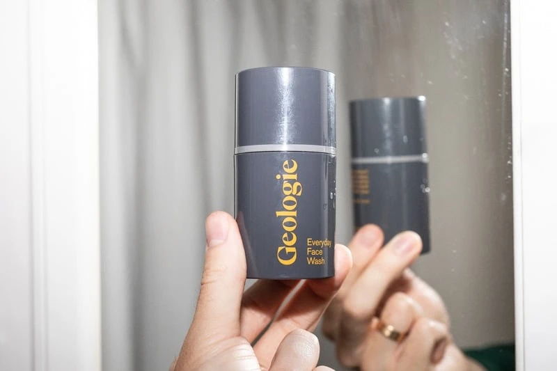 6 Best Skincare Sets for Men: All-in-Ones That Just Work 49 Geologie everyday face wash in front of mirror