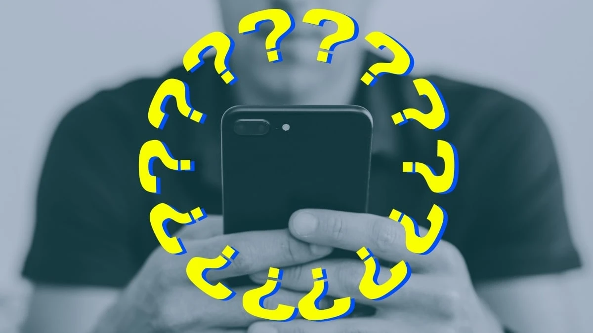 The Adult Man 7 Things to do When a Girl Doesn't Text You Back Man on Phone WIth Question Marks Around Cell