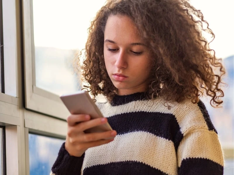 The Adult Man Girl Upset Looking at Phone