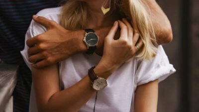 2021/10/Couple-Watches-Man-and-Girlfriend-Wearing-His-and-Hers-Watches-and-Hugging.jpgw3.webp