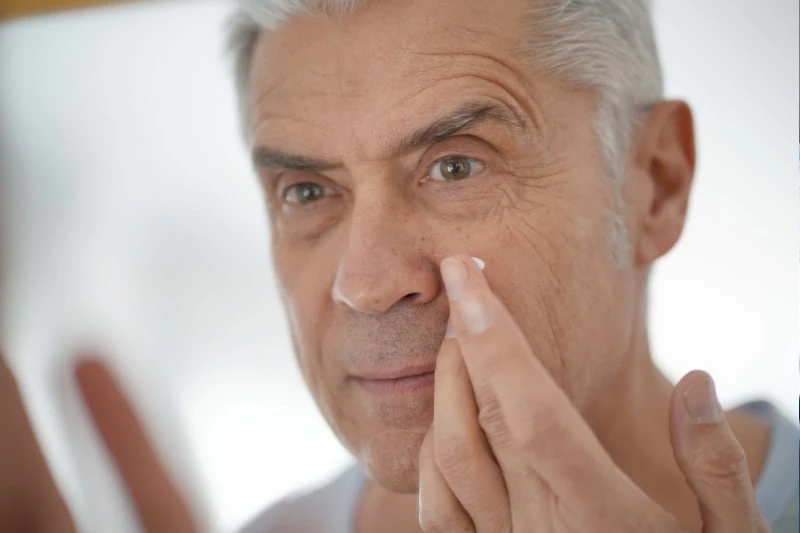 How to Care for Oily Skin: A Man’s Guide for 2024 44 older man using skin care