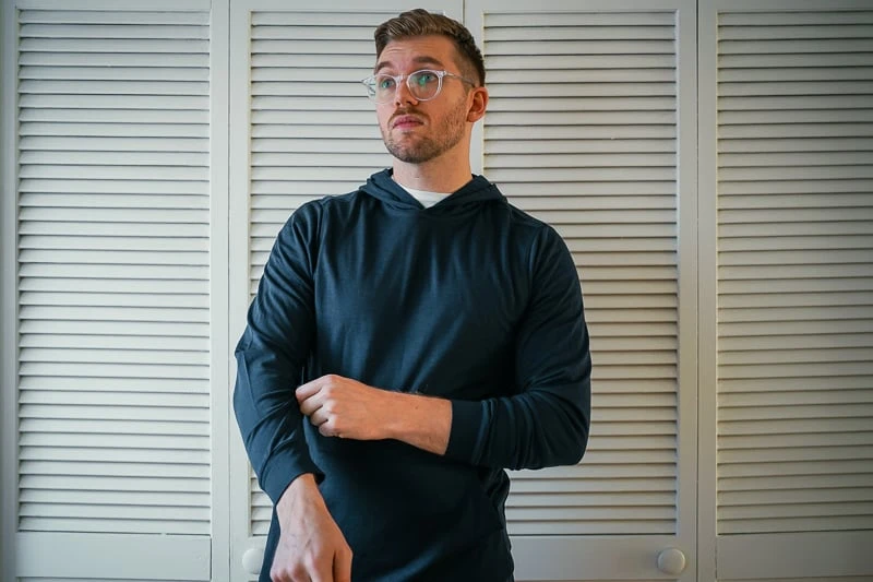 Unbound Merino Turns Luxe Wool into Utilitarian Might 51 Man in blue Unbound Merino hoodie