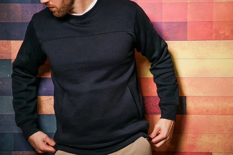 Alo Yoga Review: How Does This Activewear Brand Stand Out from the Rest? 50 Man wearing black Alo Yoga sweater