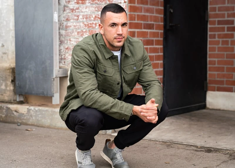 tentree Review: I Tried Their Most Popular Styles 47 Model crouching in tentree gear