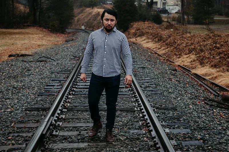 model wearing gingham dress shirt under 510