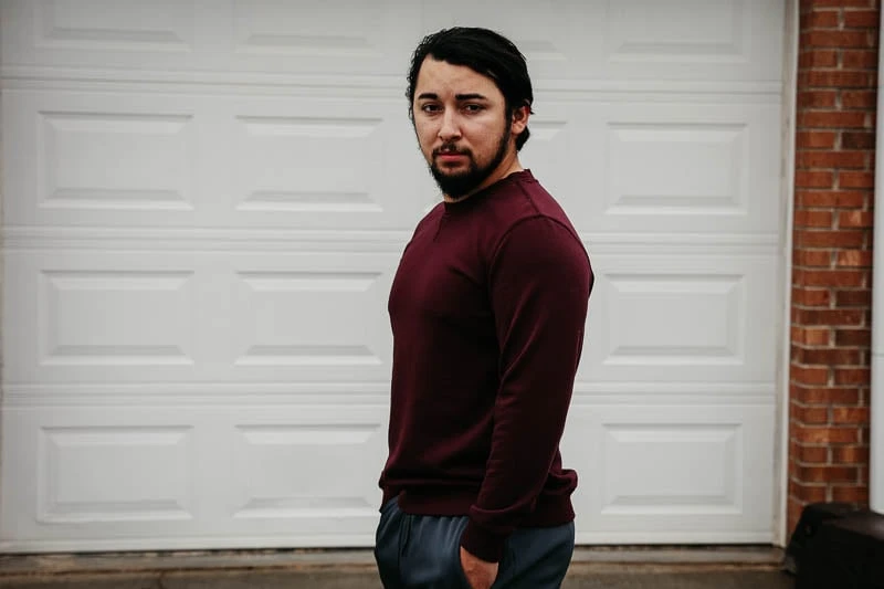 model wearing under 510 crewneck burgundy sweater