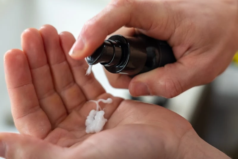 Model using Freedom Grooming aftershave lotion