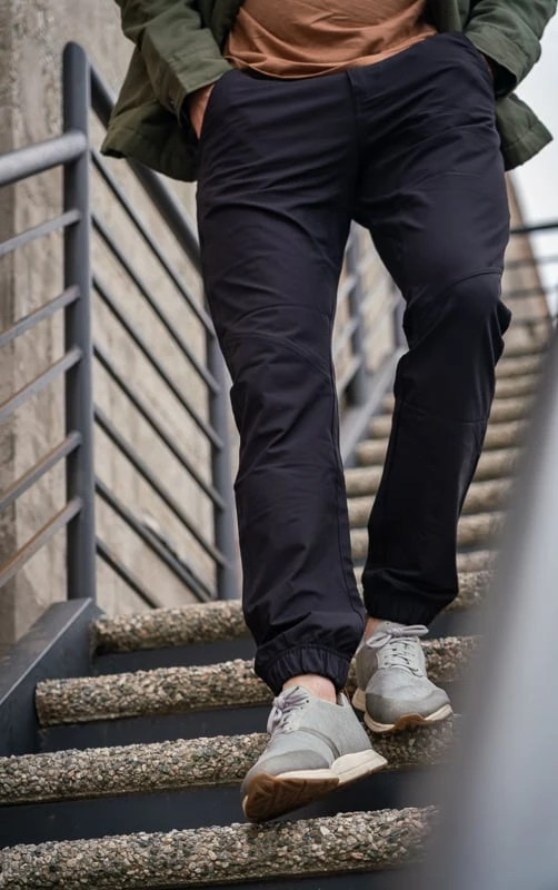 Model walking down stairs in tentree