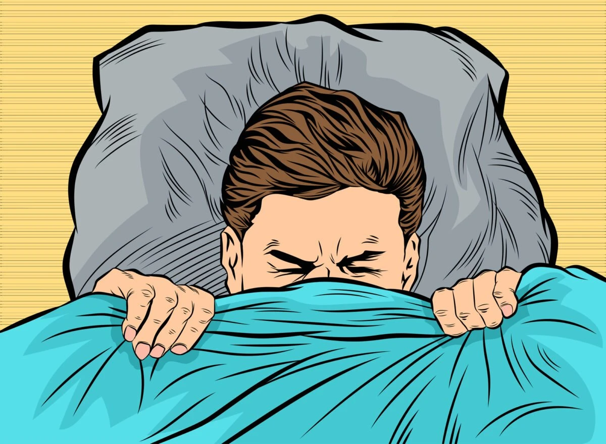 Cartoon man upset in bed