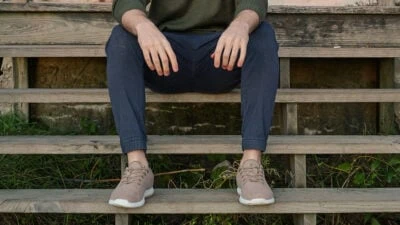 2022/06/Types-of-Pants-for-Men-Model-Wearing-Unbound-Merino-Joggers-Sitting-on-Stairs.jpgw3.webp