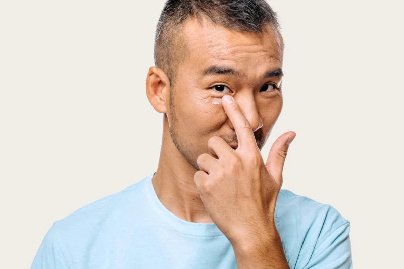 Man applying Geologie Anti Aging Eye Cream